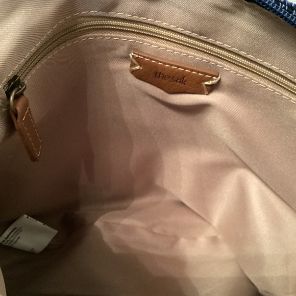 The Sak Ryder crochet crescent crossbody bag in navy blue with a tassel - Picture 12 of 14